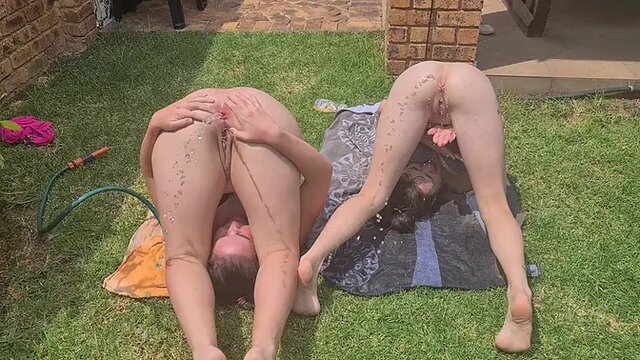 Two slutty friends squirt water from their chubby asses in the garden