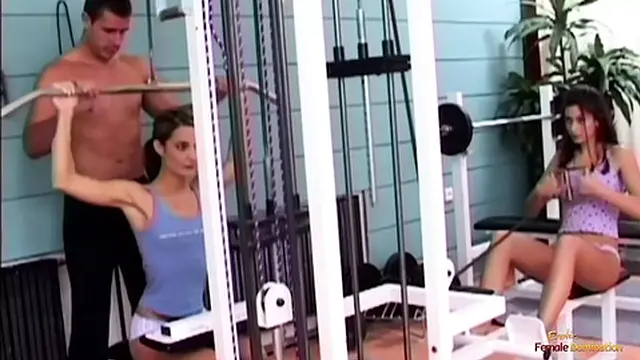 Two slender brunettes enjoy a hot threesome with a gym teacher